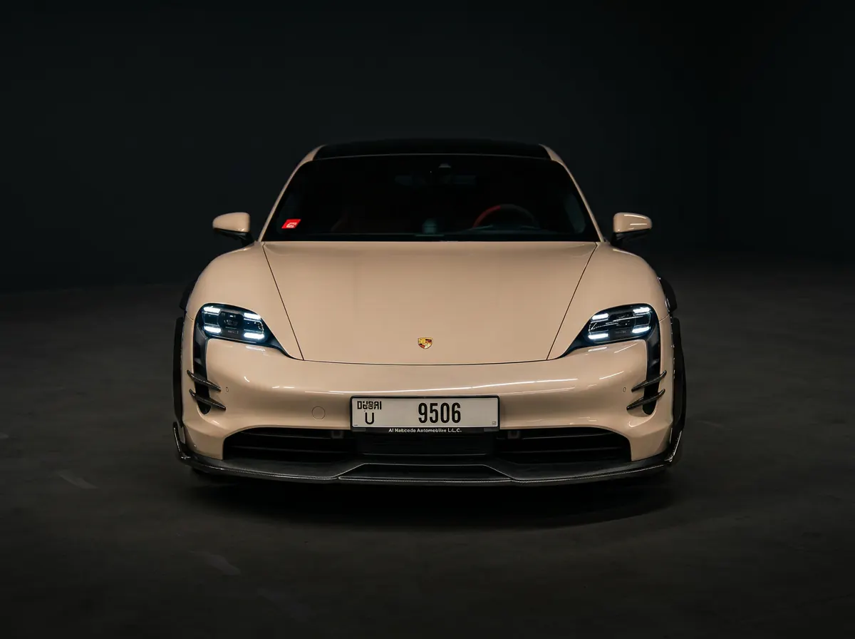 Porsche Taycan, front, dark studio