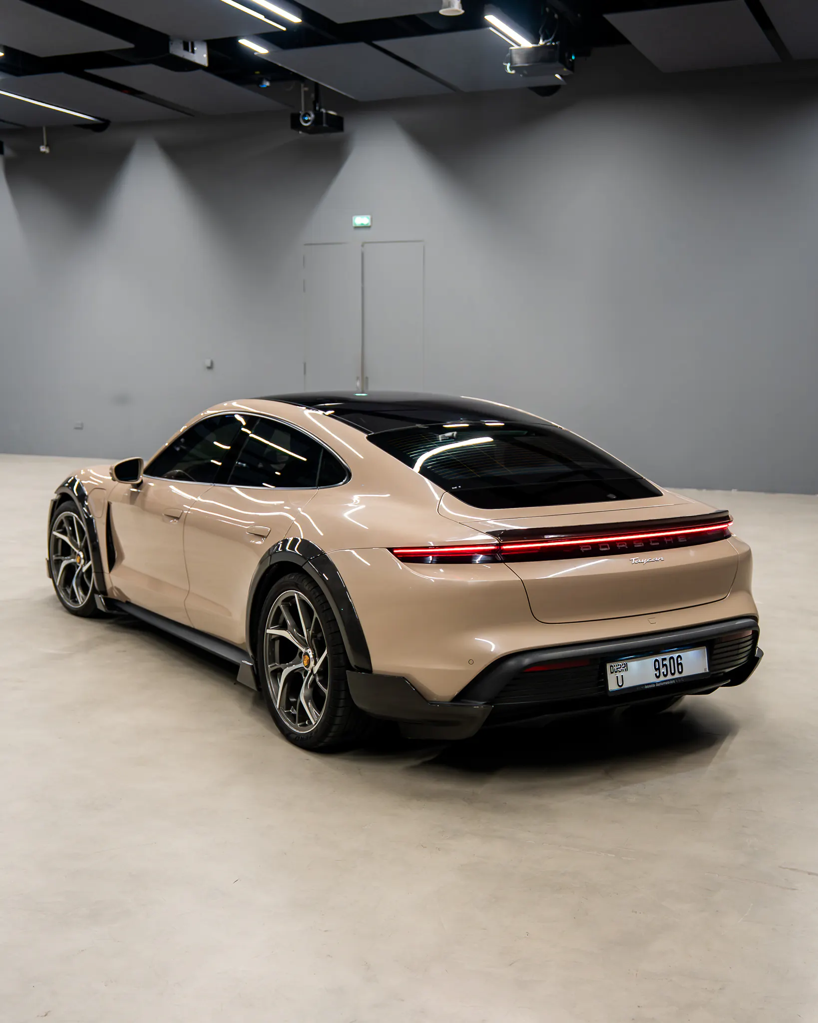 Porsche Taycan, rear three-quarter, carbon diffuser